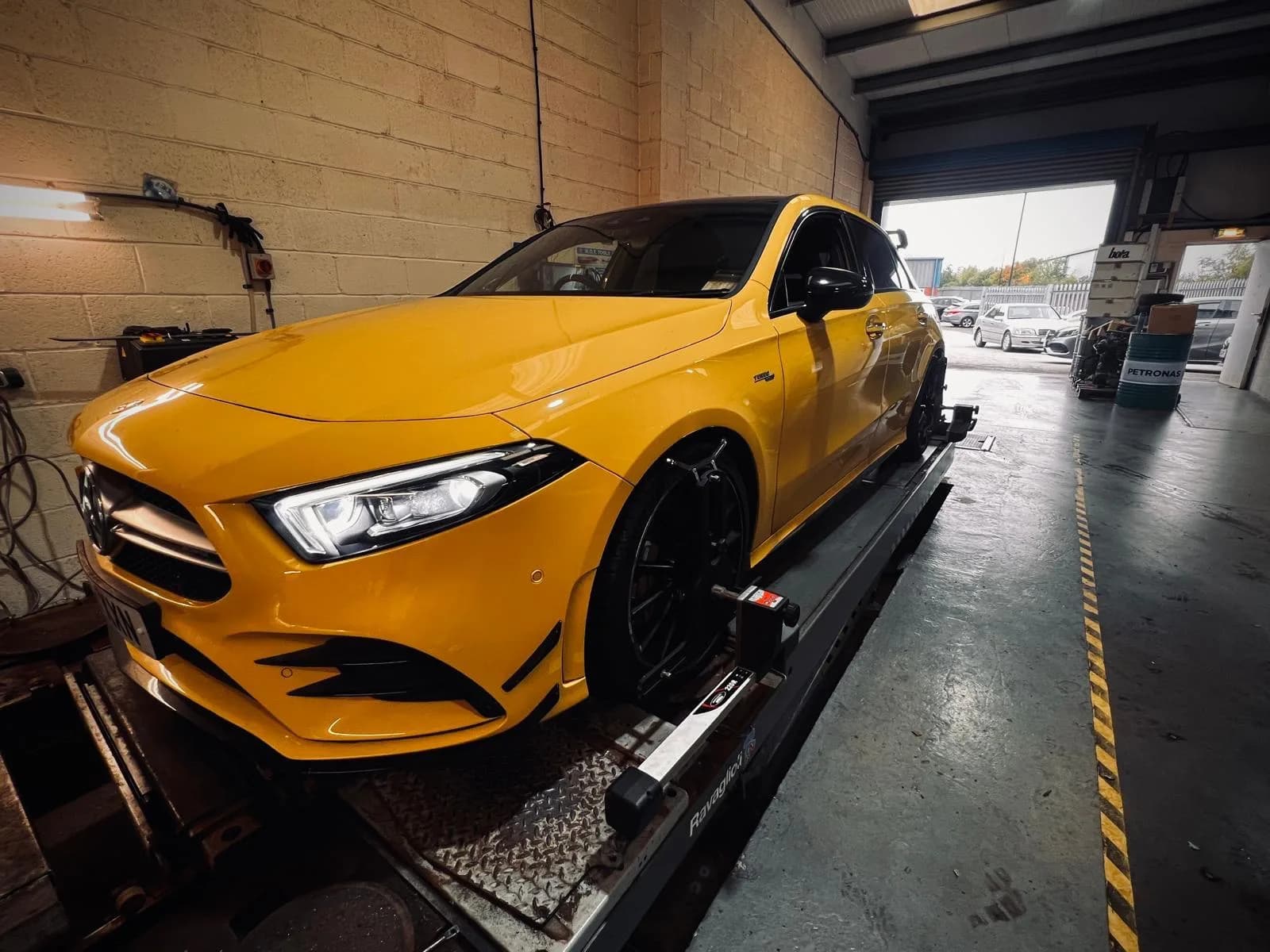 Mercedes-AMG on wheel alignment equipment at Benza Autos